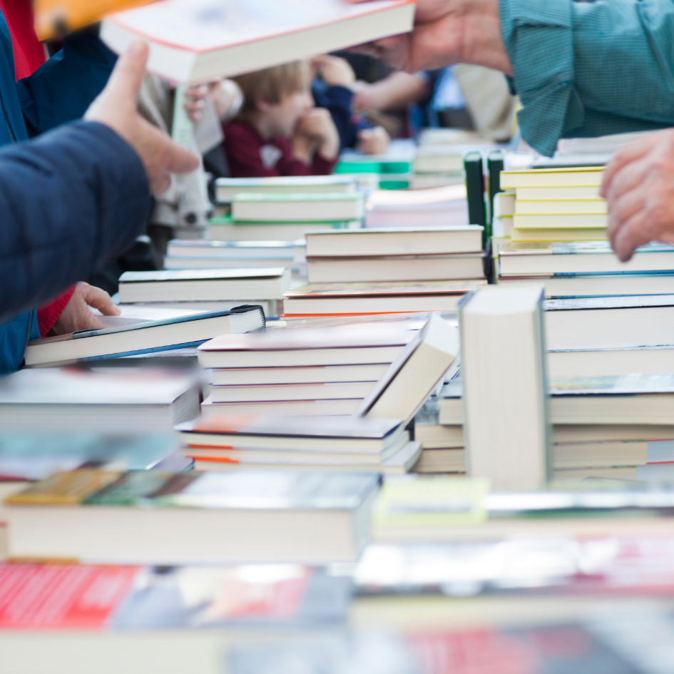 Table with piles of books.