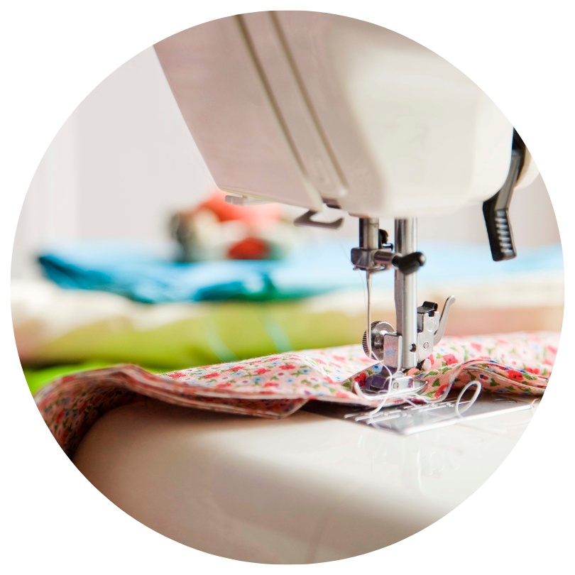 Close up of fabric in a sewing machine.