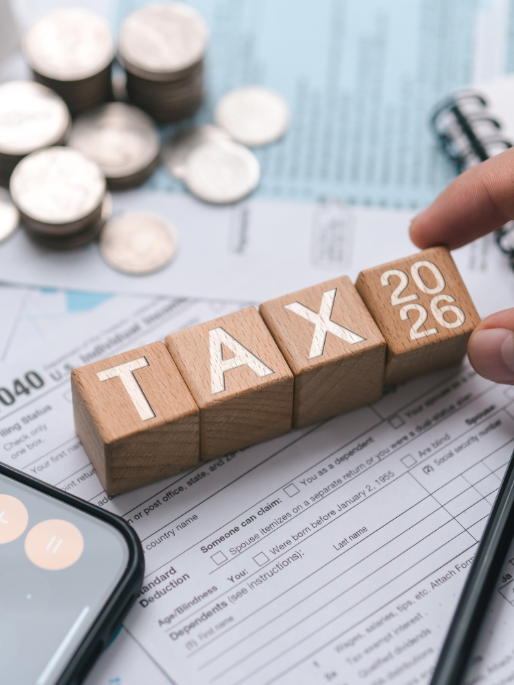 Tax preparation documents with money and calculator.