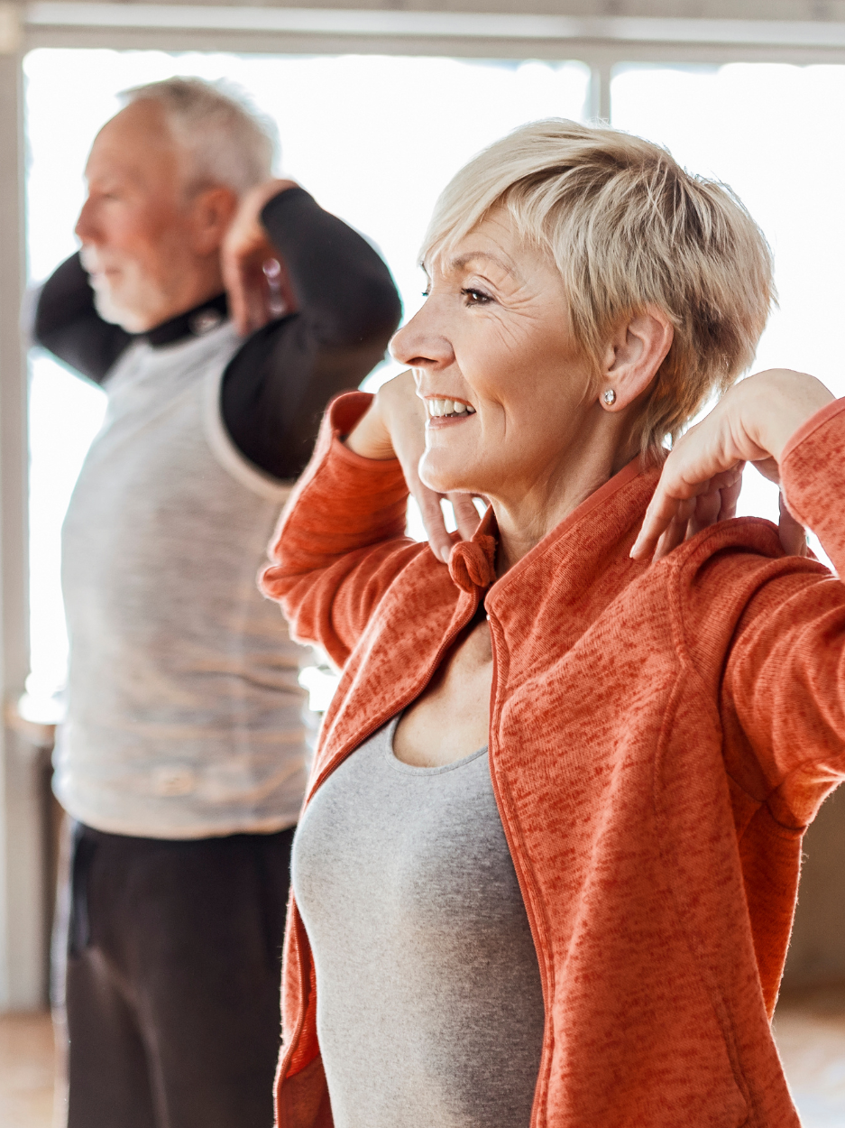 Two adults doing exercise.