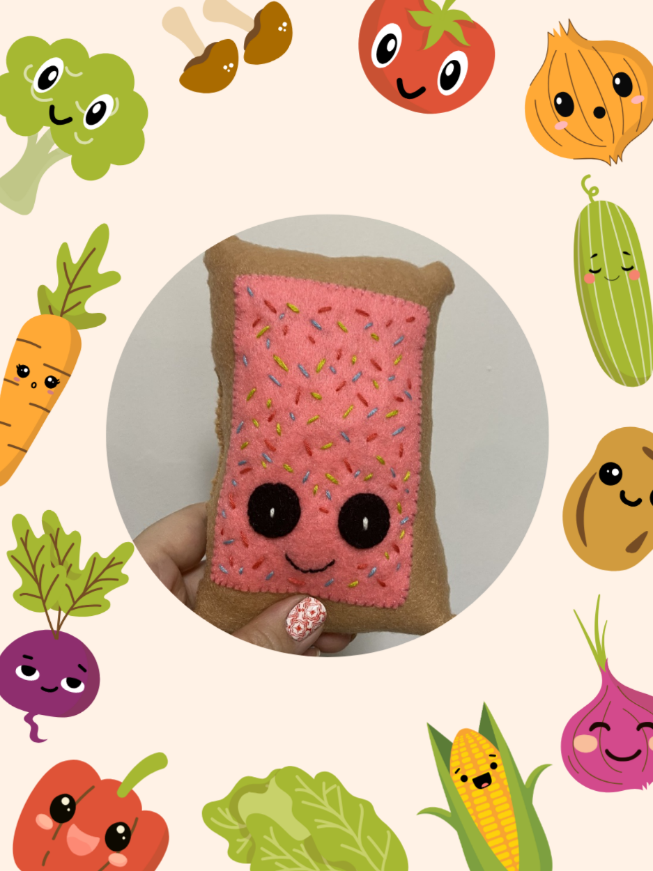Pop-Tart felt craft surrounded by vegetables.