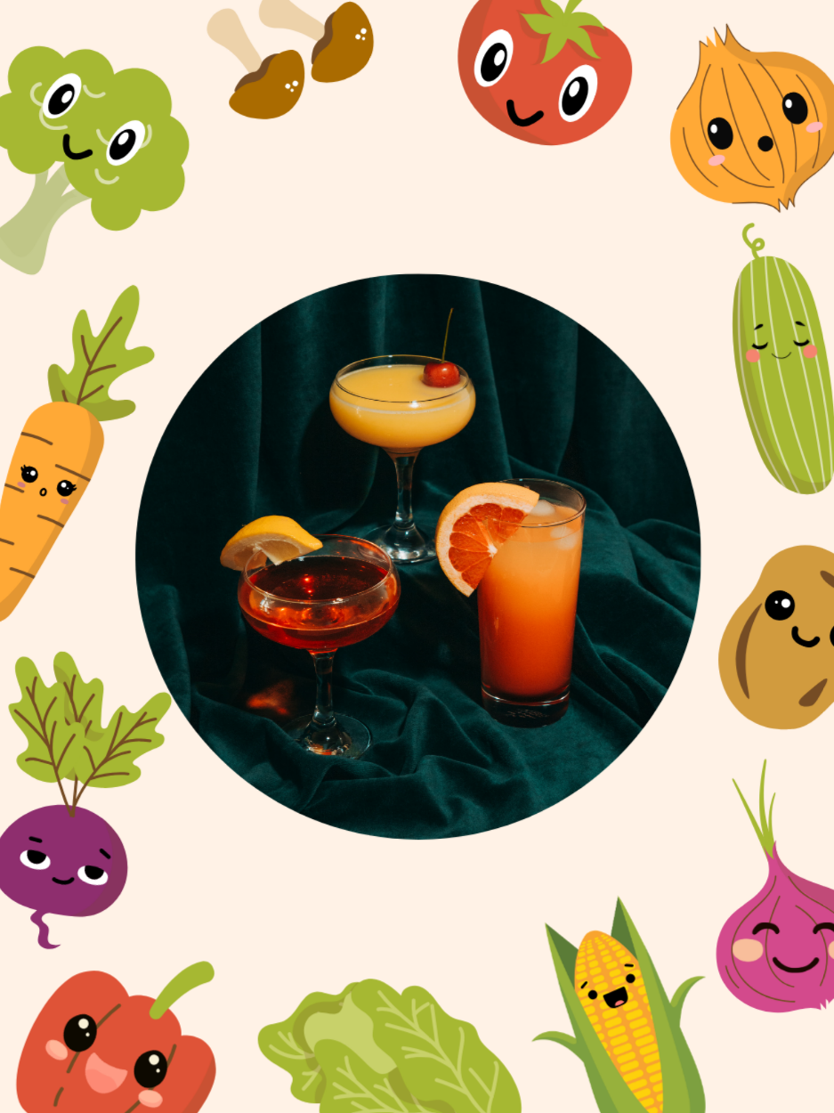 Three cocktails surrounded by vegetables.