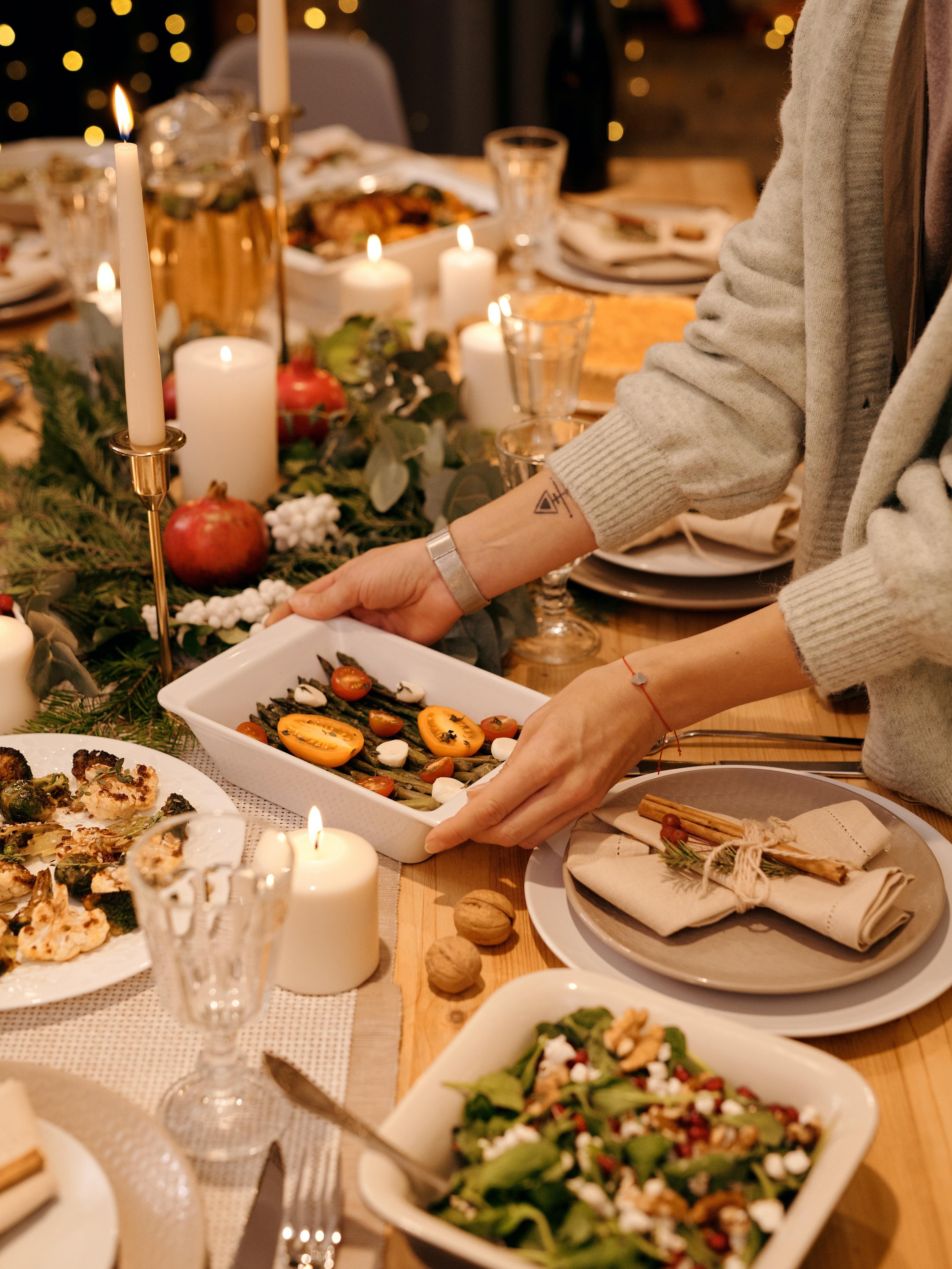 holiday table with various dishes being served