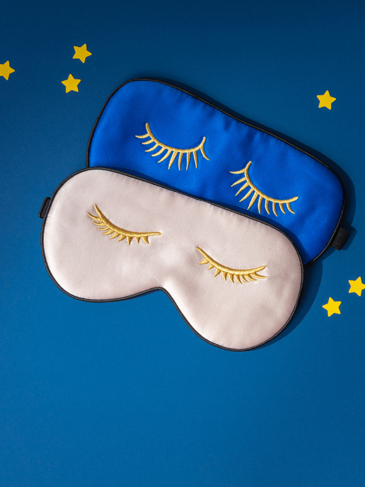 A pair of sleep masks with stars.