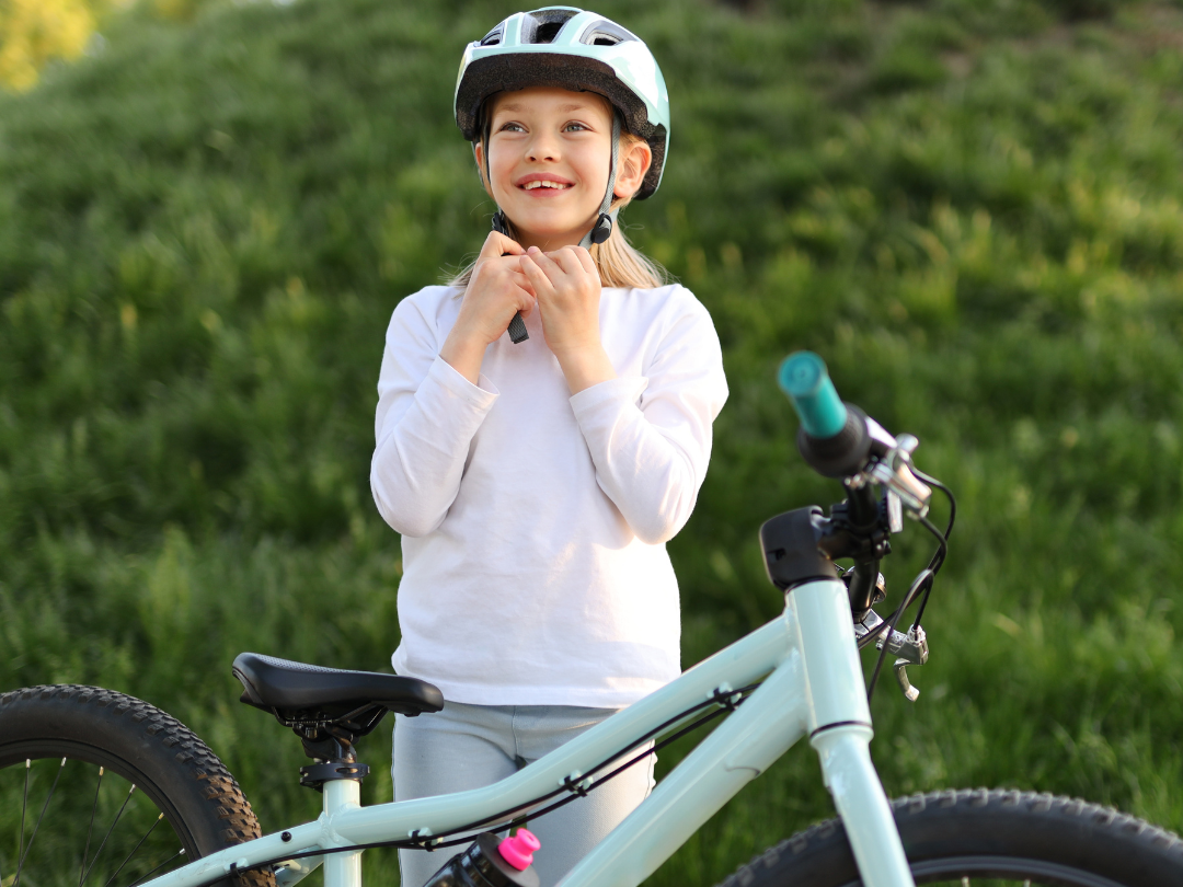Young child with bicycle.