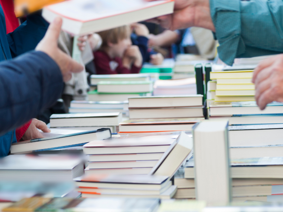Table with piles of books.