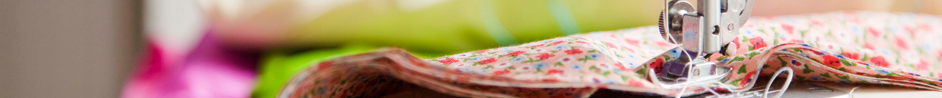 Close up of sewing machine needle and fabric.